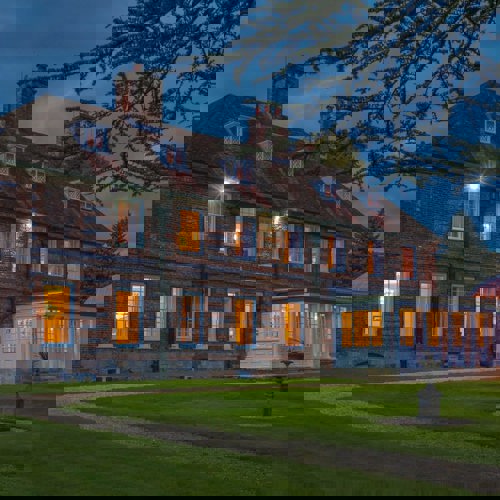 <p>THE MANOR HOUSE AT NIGHT</p>